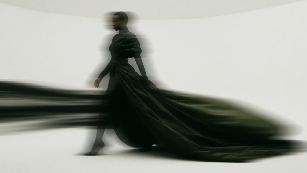 Runway look in motion — editorial capture on the NEXUS floor.